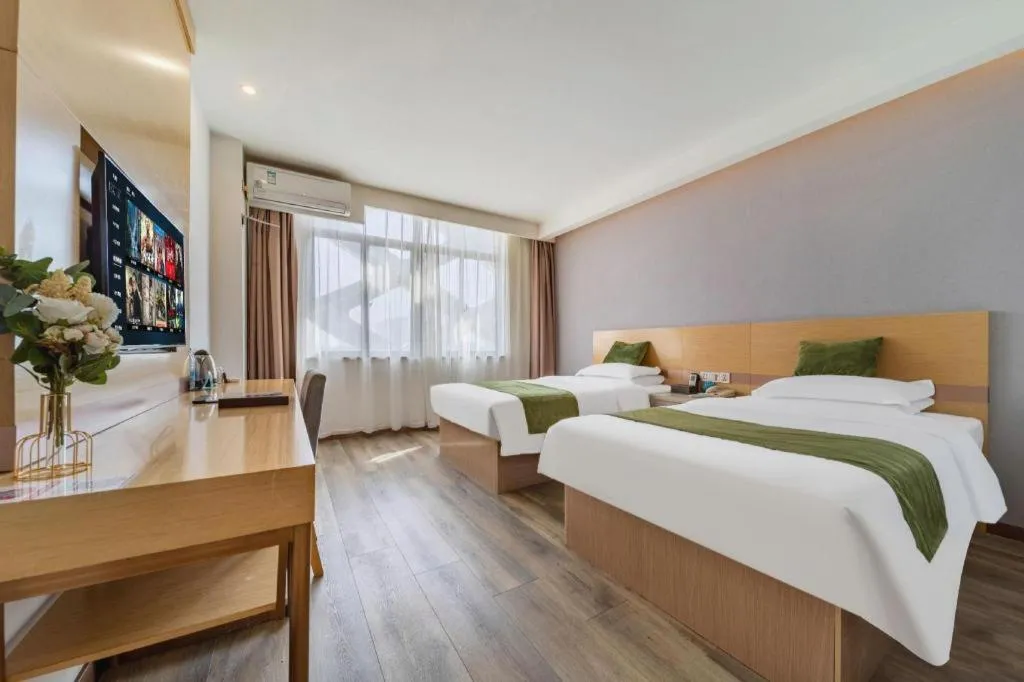 Bed in GreenTree Inn Nantong Zhangzhishan Town Deli Plaza Express Hotel