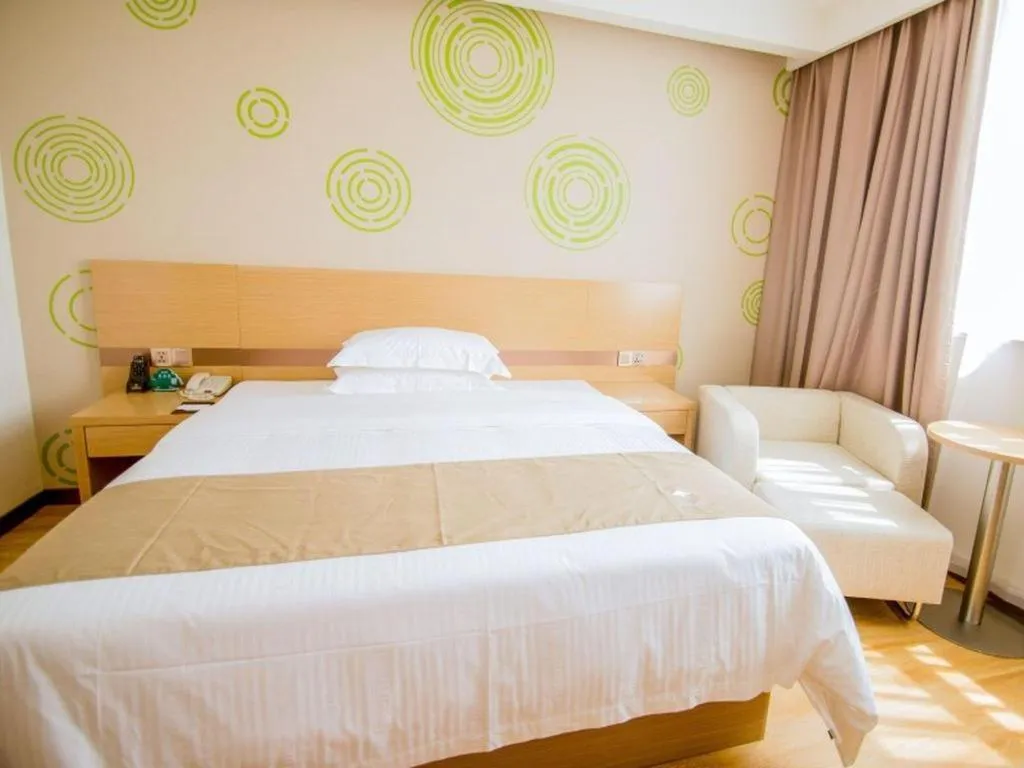 Bed in GreenTree Inn Nantong Zhangzhishan Town Deli Plaza Express Hotel
