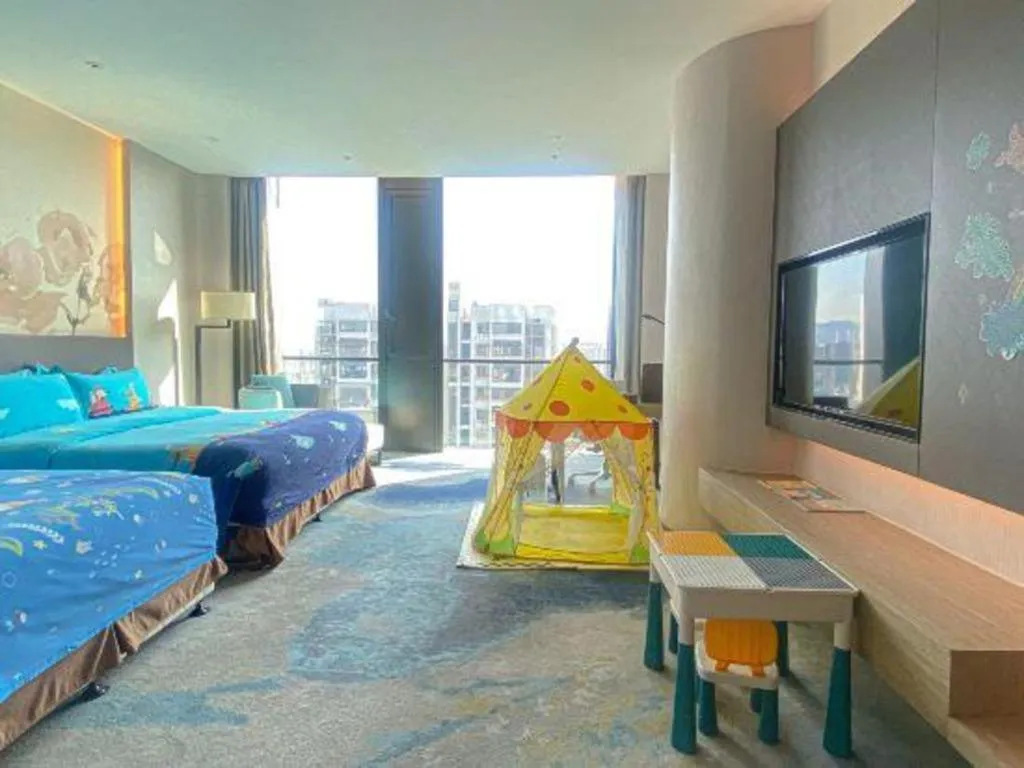 Bed in LONGYAN JINGHUA FLIPORT HOTEL