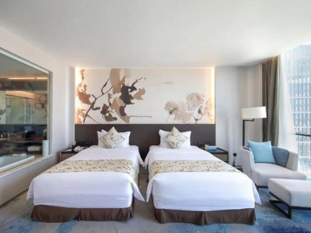 Bed in LONGYAN JINGHUA FLIPORT HOTEL