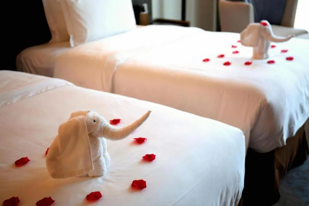 Bed in LONGYAN JINGHUA FLIPORT HOTEL