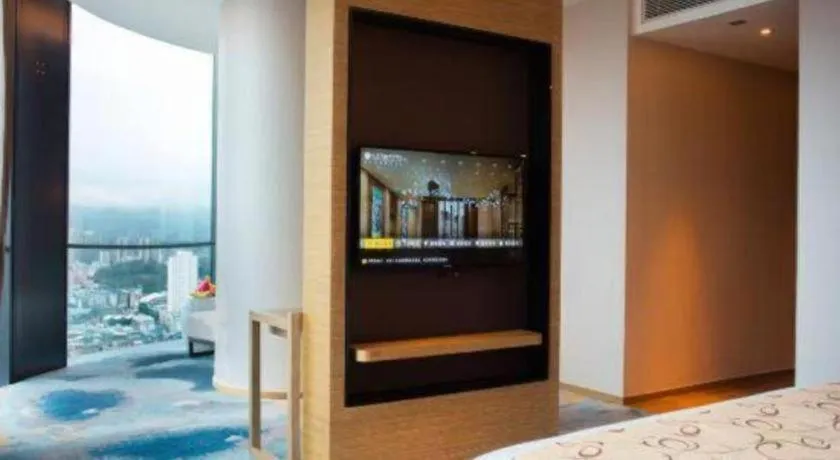 Bed in LONGYAN JINGHUA FLIPORT HOTEL