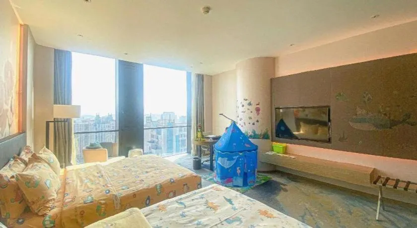 Bed in LONGYAN JINGHUA FLIPORT HOTEL