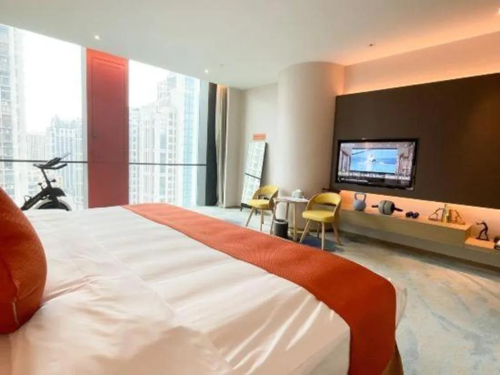 Bed in LONGYAN JINGHUA FLIPORT HOTEL