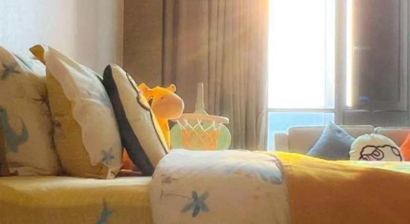 Bed in LONGYAN JINGHUA FLIPORT HOTEL