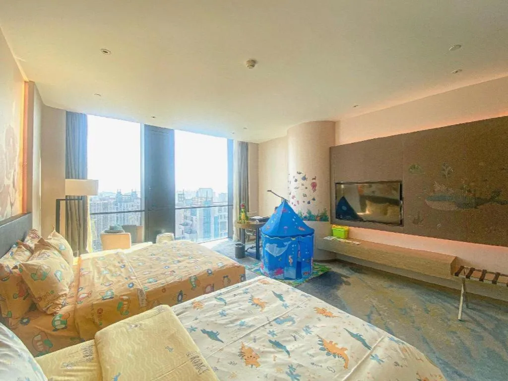 Bed in LONGYAN JINGHUA FLIPORT HOTEL