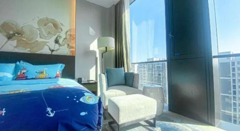 Bed in LONGYAN JINGHUA FLIPORT HOTEL