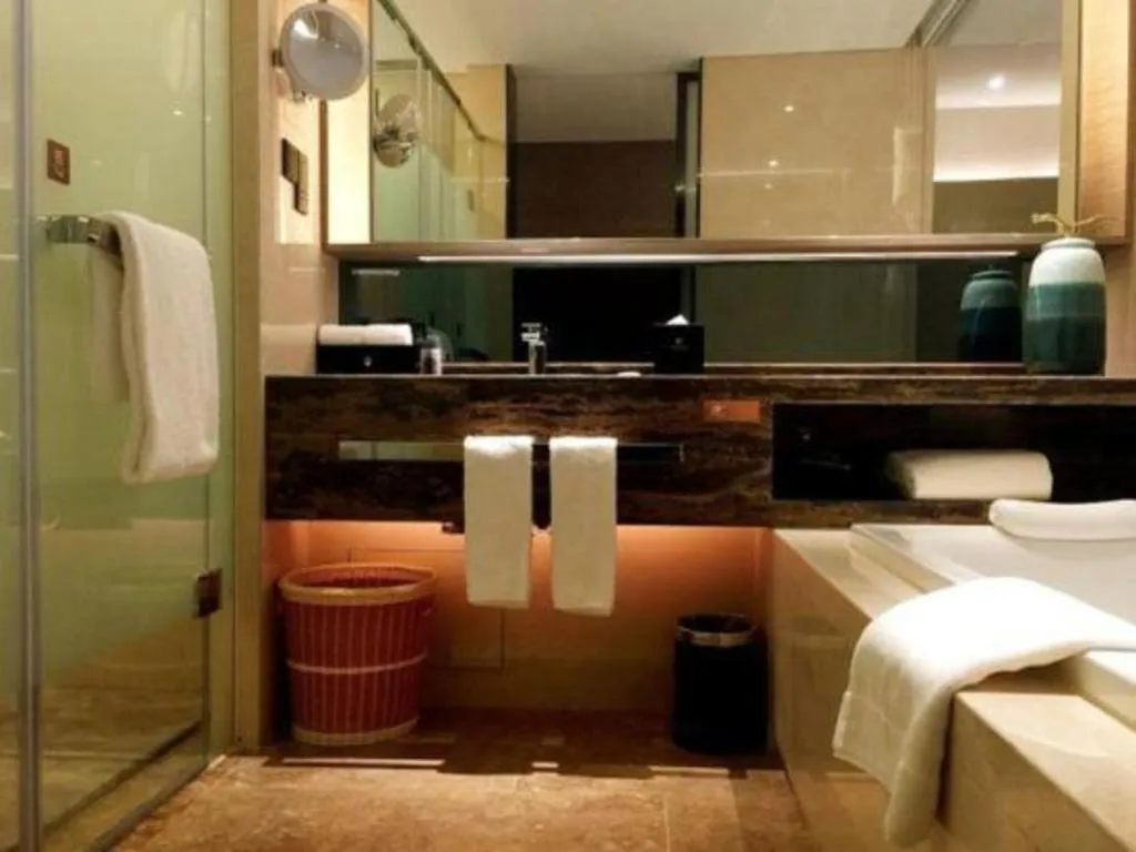 Bed in LONGYAN JINGHUA FLIPORT HOTEL