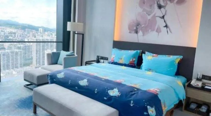 Bed in LONGYAN JINGHUA FLIPORT HOTEL