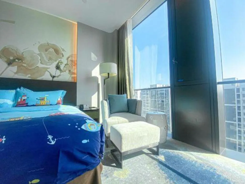 Bed in LONGYAN JINGHUA FLIPORT HOTEL