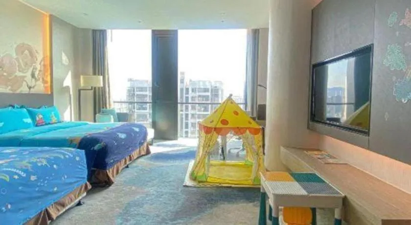 Bed in LONGYAN JINGHUA FLIPORT HOTEL