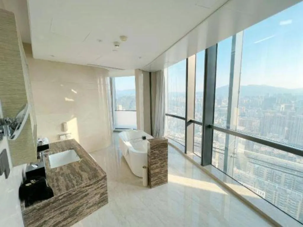 Bed in LONGYAN JINGHUA FLIPORT HOTEL