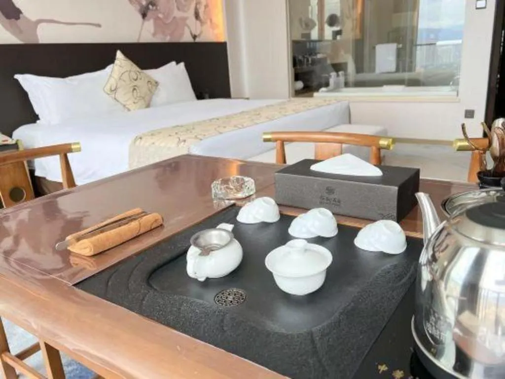 Bed in LONGYAN JINGHUA FLIPORT HOTEL