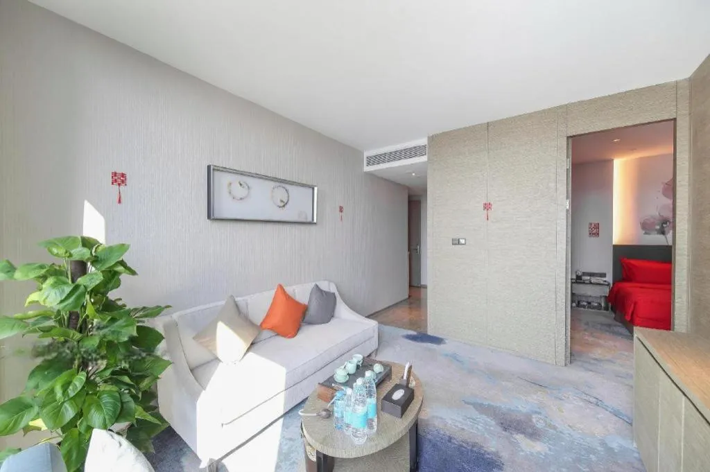 Bed in LONGYAN JINGHUA FLIPORT HOTEL