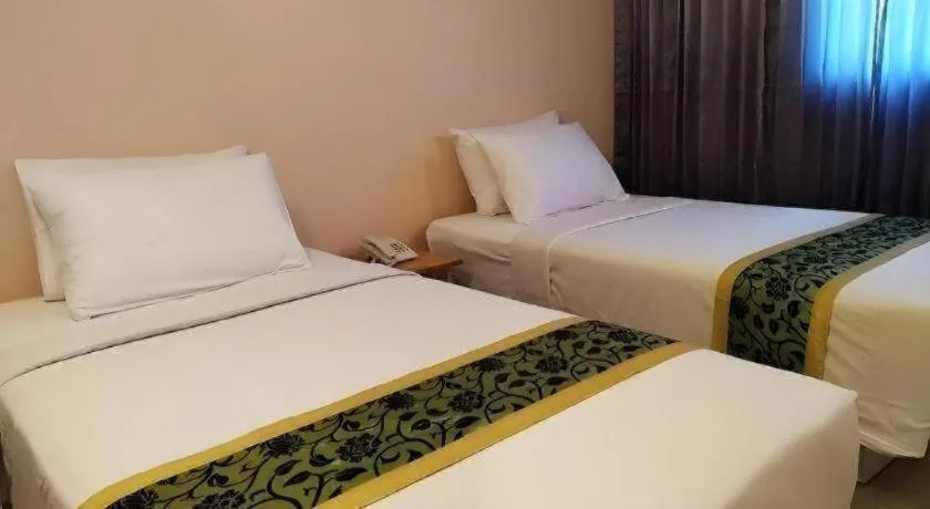Bed in BIRD ROOM HOTEL - PRATUNAM