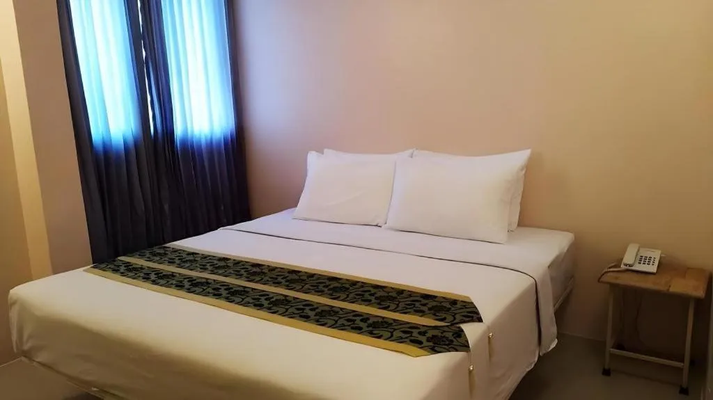 Bed in BIRD ROOM HOTEL - PRATUNAM