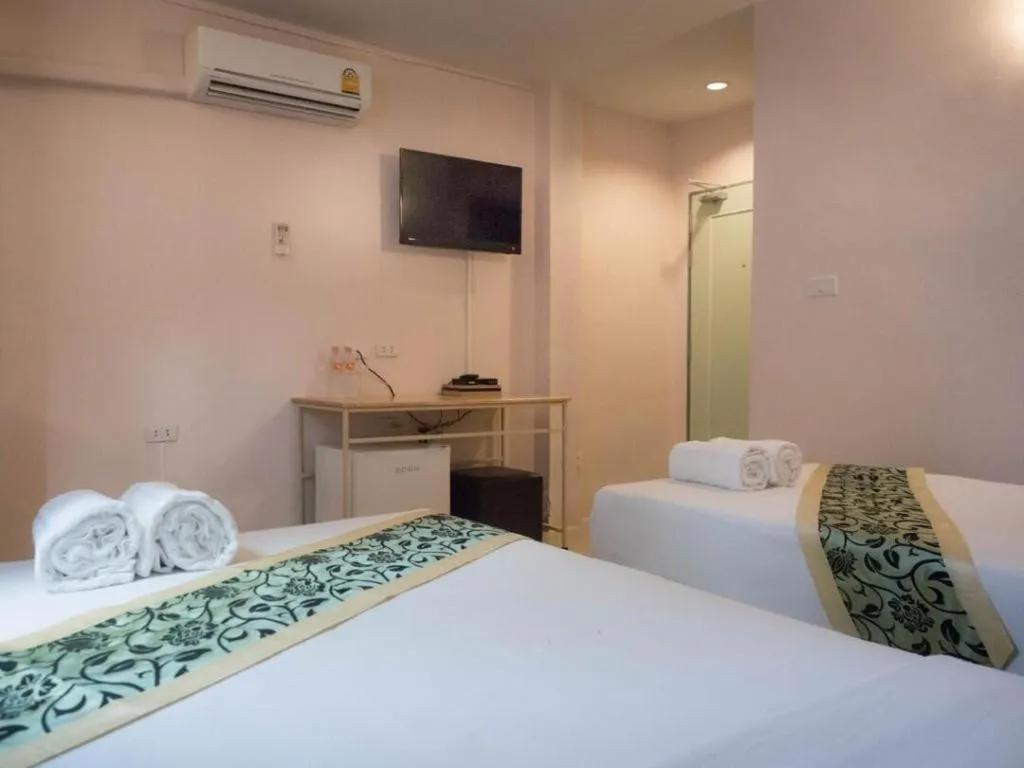 Bed in BIRD ROOM HOTEL - PRATUNAM