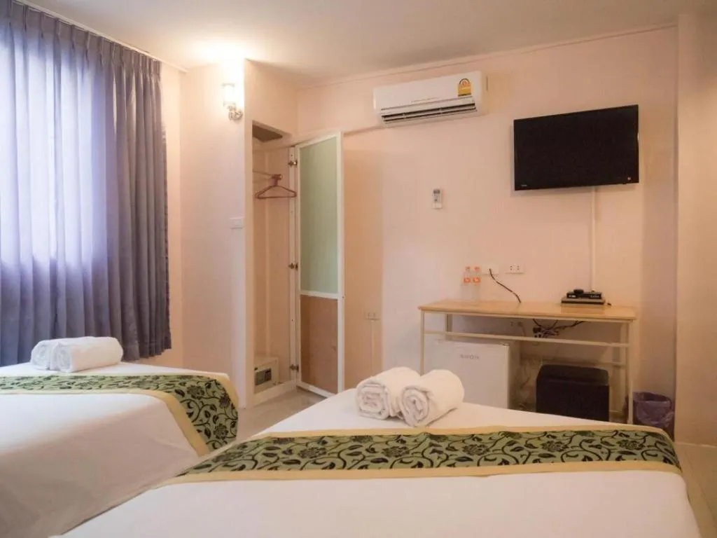 Bed in BIRD ROOM HOTEL - PRATUNAM