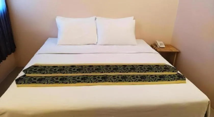 Bed in BIRD ROOM HOTEL - PRATUNAM