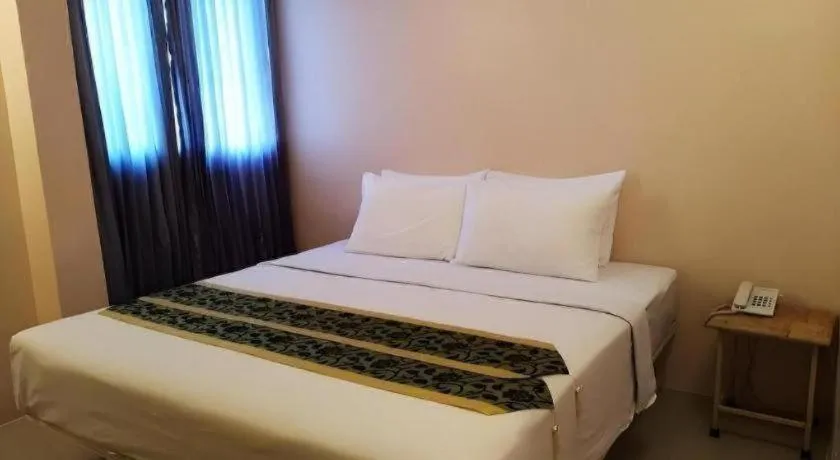 Bed in BIRD ROOM HOTEL - PRATUNAM