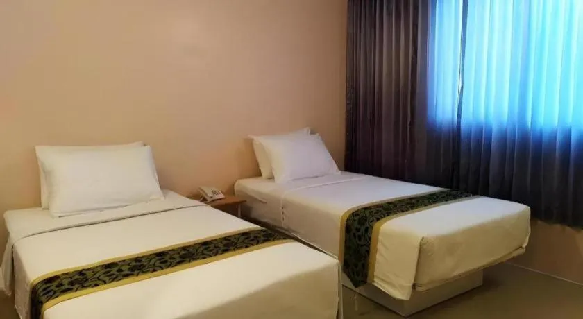 Bed in BIRD ROOM HOTEL - PRATUNAM