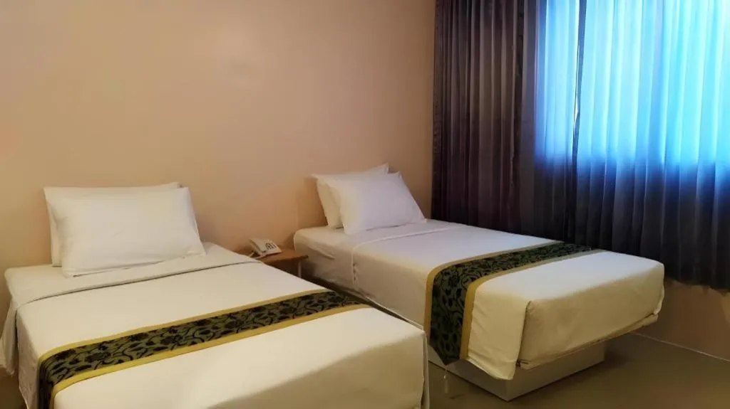 Bed in BIRD ROOM HOTEL - PRATUNAM