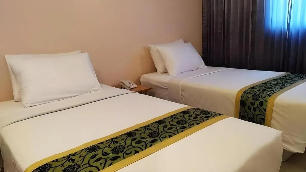 Bed in BIRD ROOM HOTEL - PRATUNAM