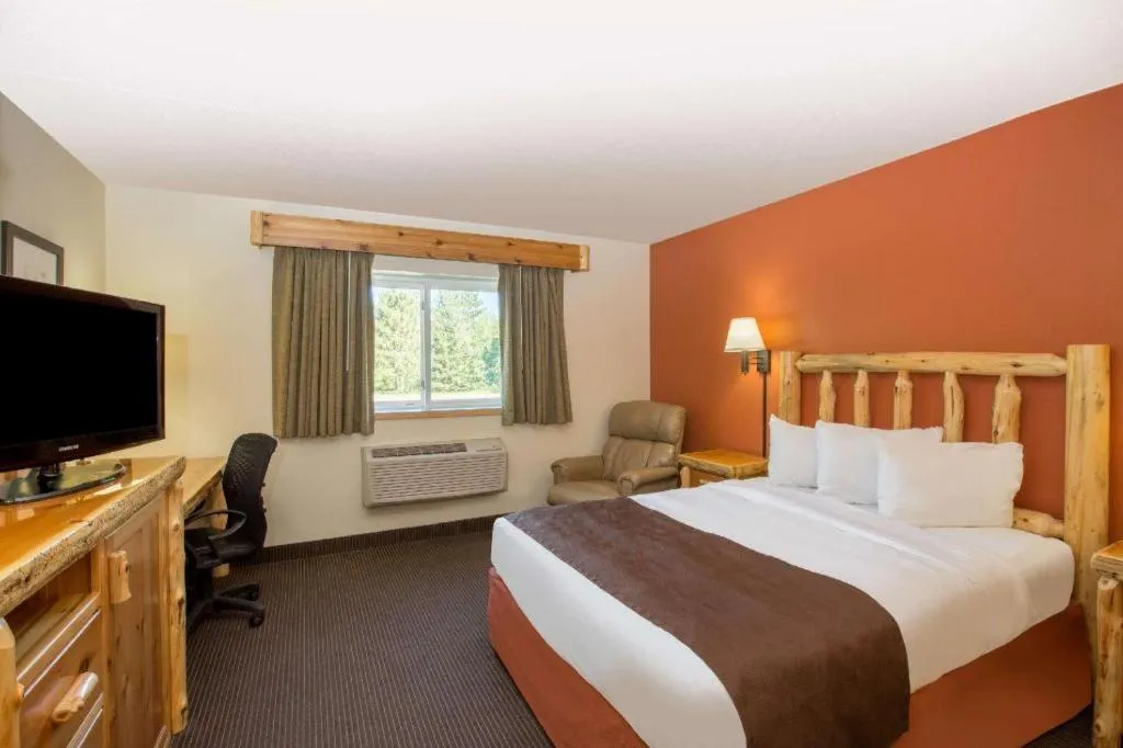 Bed in AmericInn by Wyndham Pequot Lakes