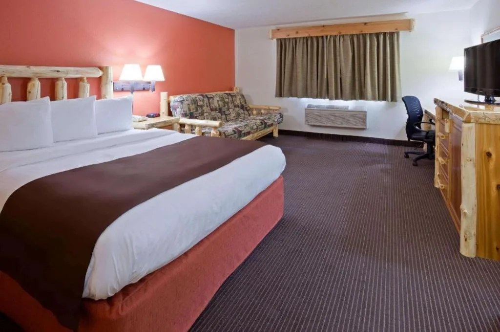 Bed in AmericInn by Wyndham Pequot Lakes