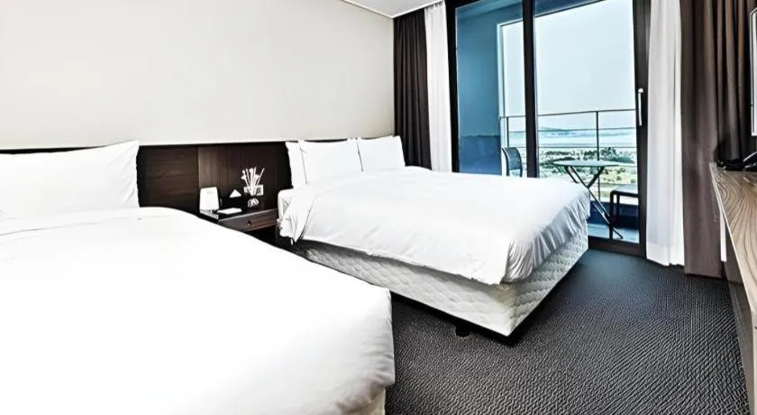 Bed in Riviera Incheon Airport Hotel