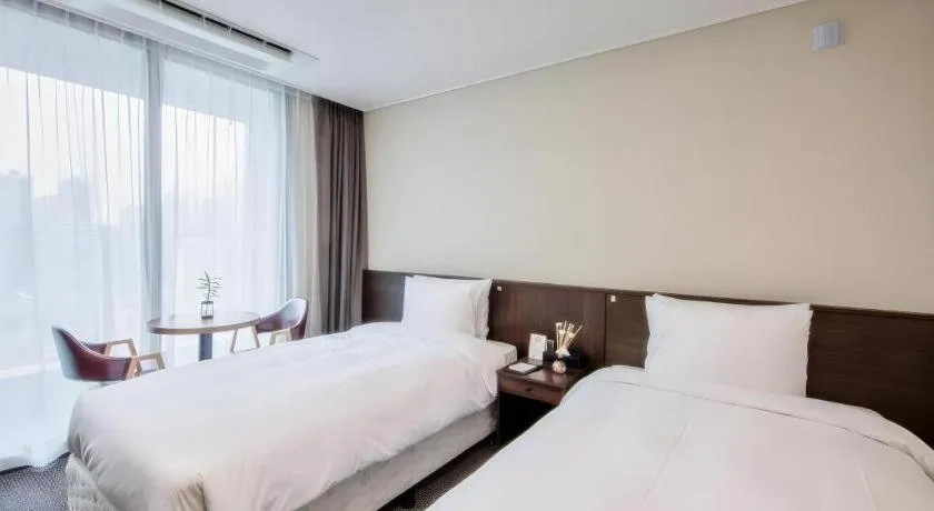 Bed in Riviera Incheon Airport Hotel