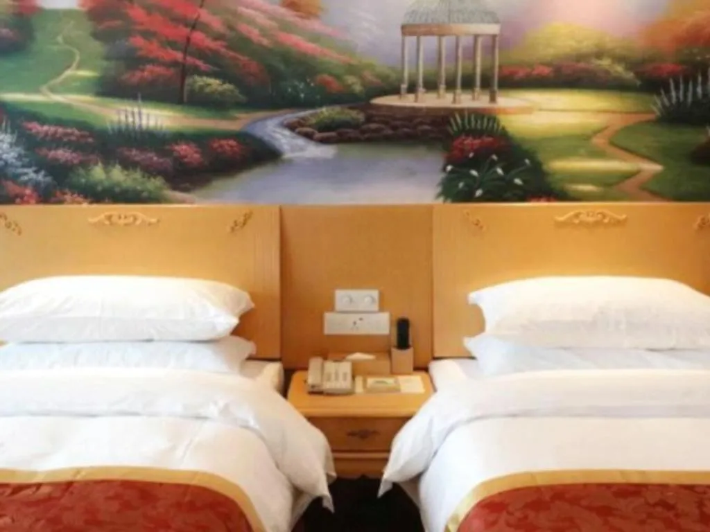 Bed in Vienna Hotel Guangdong Qingyuan Wanda Plaza Xincheng Beijiang