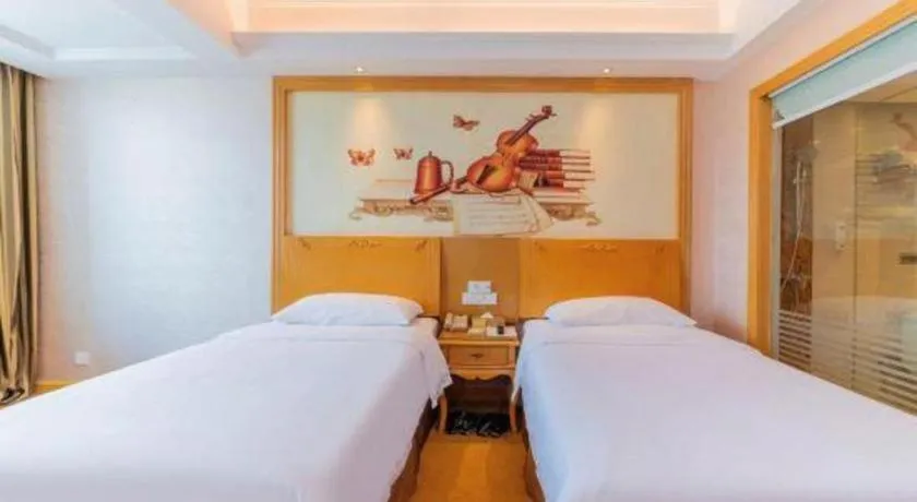 Bed in Vienna Hotel Guangdong Qingyuan Wanda Plaza Xincheng Beijiang
