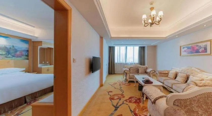Bed in Vienna Hotel Guangdong Qingyuan Wanda Plaza Xincheng Beijiang