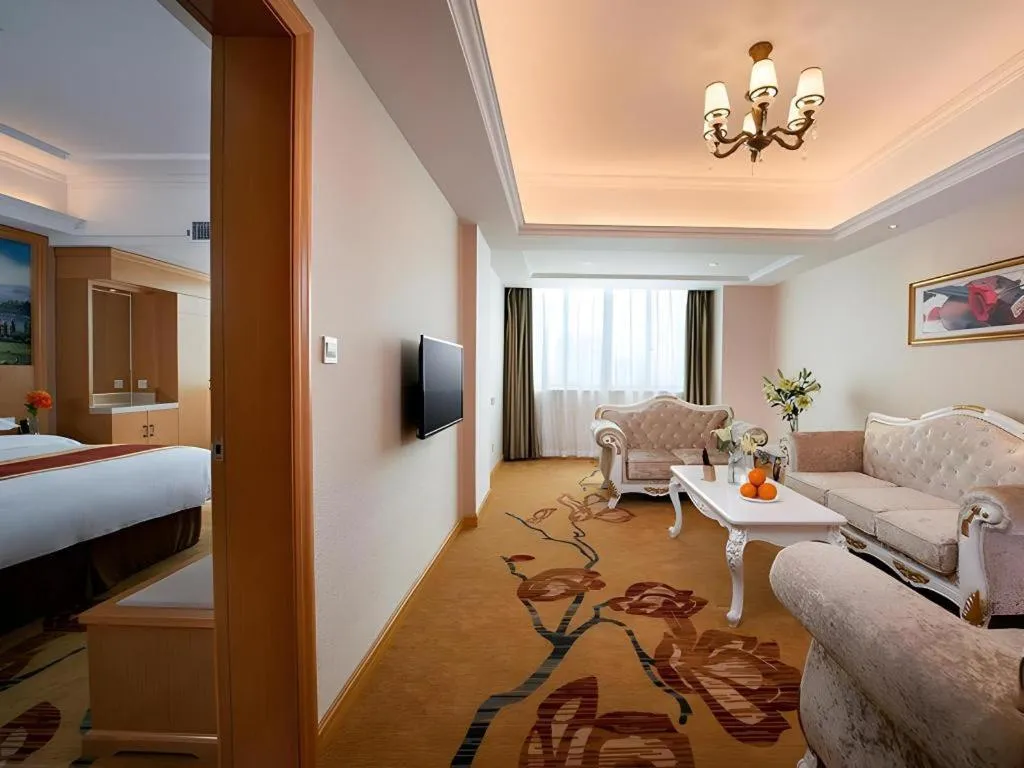 Bed in Vienna Hotel Guangdong Qingyuan Wanda Plaza Xincheng Beijiang
