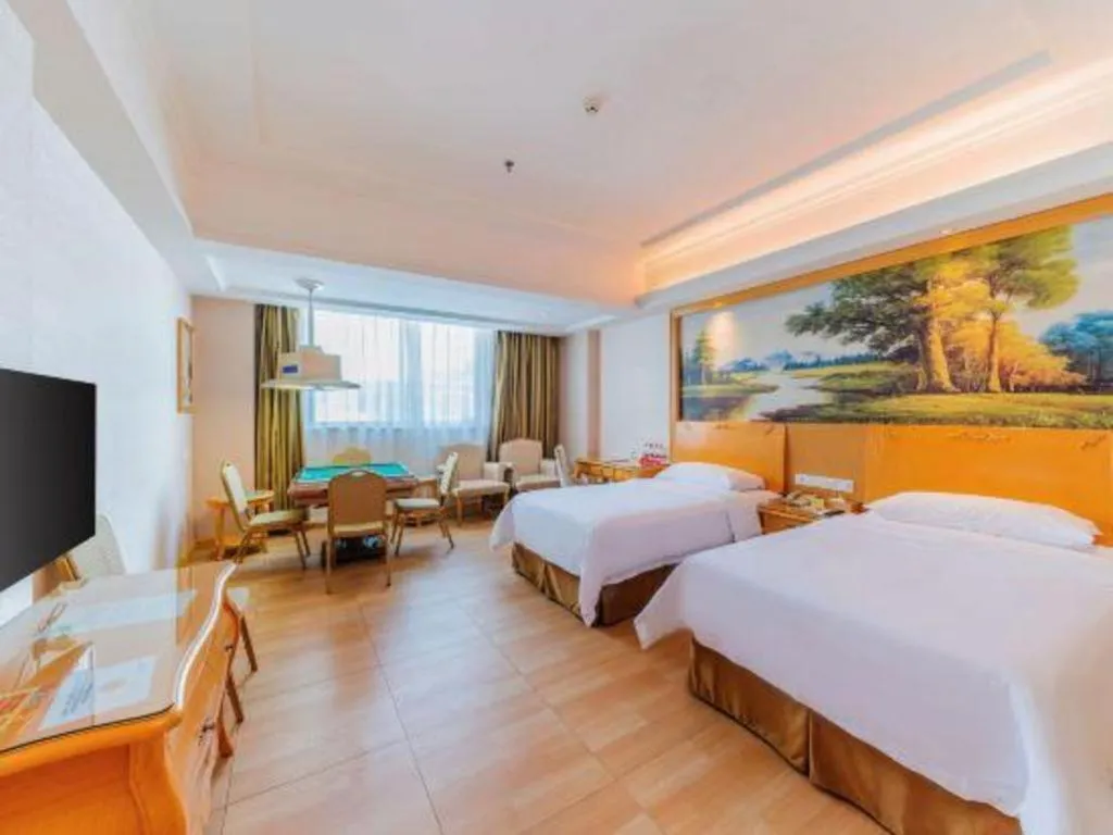 Bed in Vienna Hotel Guangdong Qingyuan Wanda Plaza Xincheng Beijiang