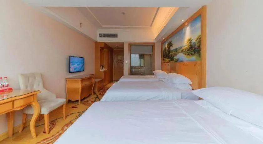 Bed in Vienna Hotel Guangdong Qingyuan Wanda Plaza Xincheng Beijiang