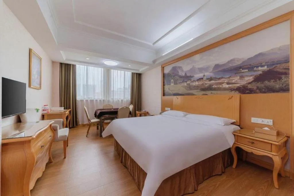 Bed in Vienna Hotel Guangdong Qingyuan Wanda Plaza Xincheng Beijiang