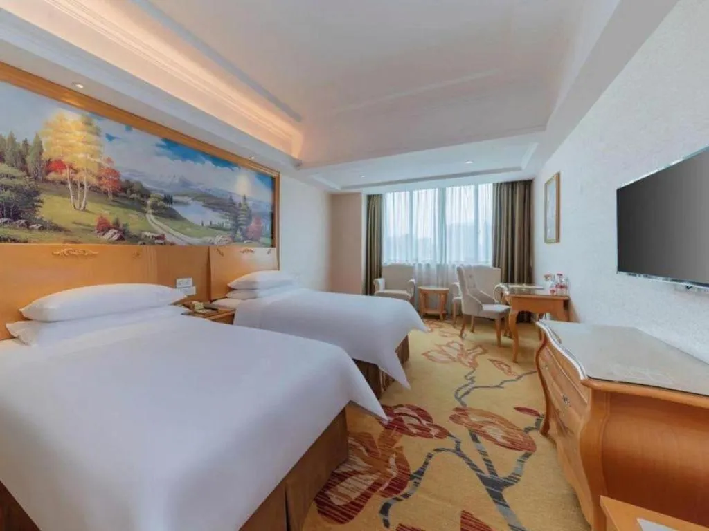 Bed in Vienna Hotel Guangdong Qingyuan Wanda Plaza Xincheng Beijiang