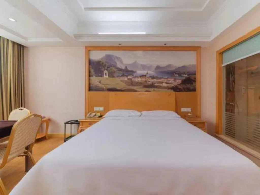 Bed in Vienna Hotel Guangdong Qingyuan Wanda Plaza Xincheng Beijiang