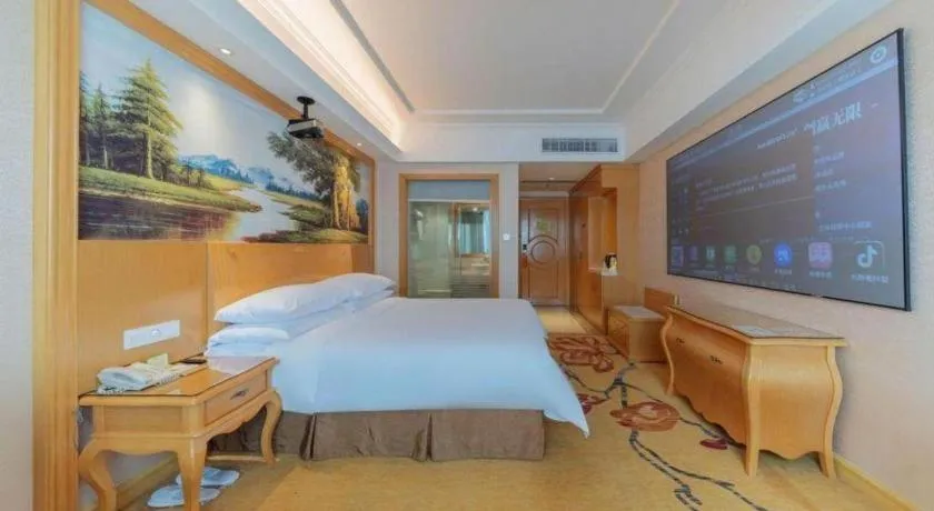 Bed in Vienna Hotel Guangdong Qingyuan Wanda Plaza Xincheng Beijiang