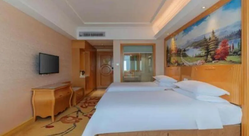 Bed in Vienna Hotel Guangdong Qingyuan Wanda Plaza Xincheng Beijiang