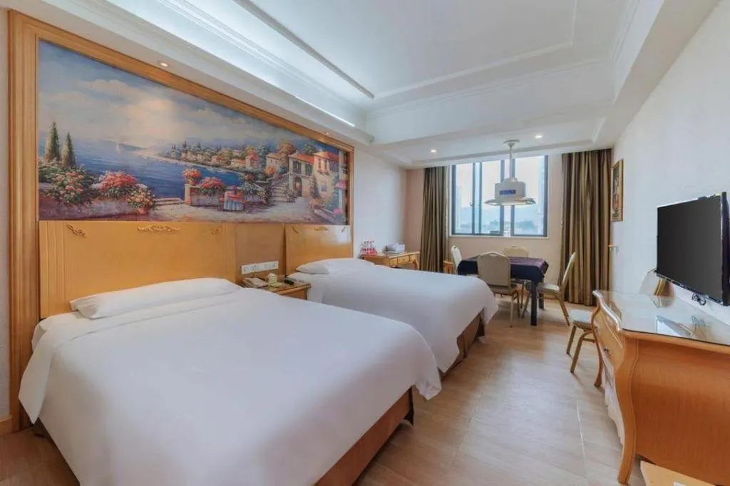 Bed in Vienna Hotel Guangdong Qingyuan Wanda Plaza Xincheng Beijiang