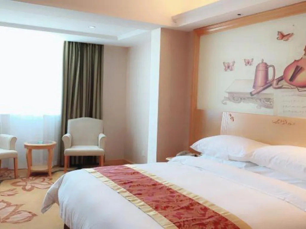 Bed in Vienna Hotel Guangdong Qingyuan Wanda Plaza Xincheng Beijiang
