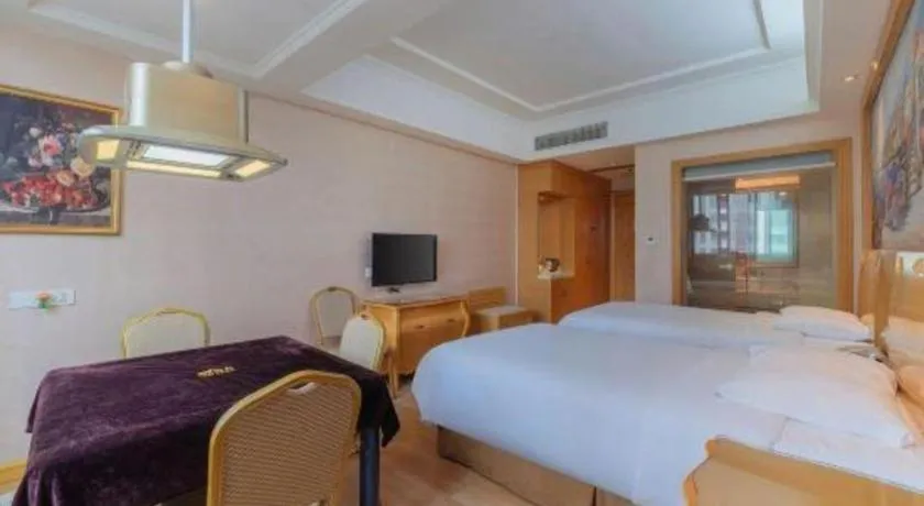 Bed in Vienna Hotel Guangdong Qingyuan Wanda Plaza Xincheng Beijiang