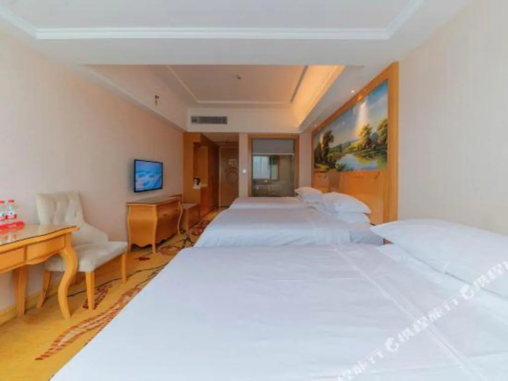 Bed in Vienna Hotel Guangdong Qingyuan Wanda Plaza Xincheng Beijiang