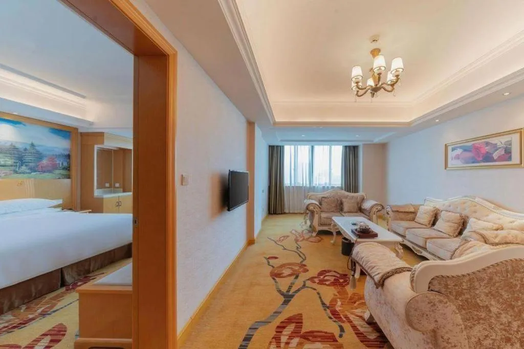 Bed in Vienna Hotel Guangdong Qingyuan Wanda Plaza Xincheng Beijiang
