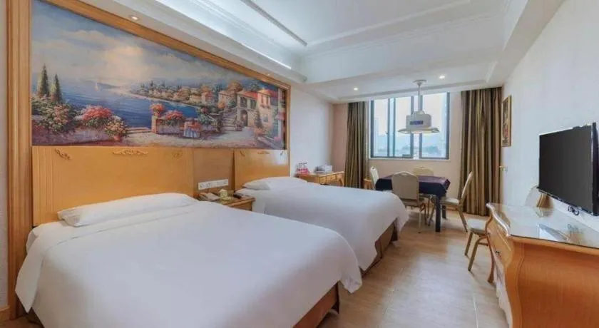 Bed in Vienna Hotel Guangdong Qingyuan Wanda Plaza Xincheng Beijiang