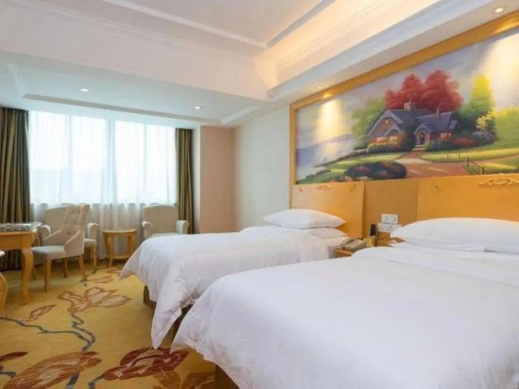 Bed in Vienna Hotel Guangdong Qingyuan Wanda Plaza Xincheng Beijiang