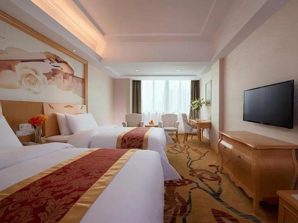 Bed in Vienna Hotel Guangdong Qingyuan Wanda Plaza Xincheng Beijiang